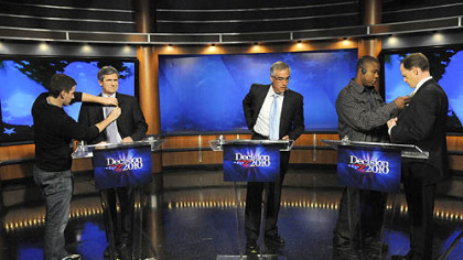 Senate candidates Joe Sestak, left, and Pat Toomey, right, prepare for a debate moderated by David Johnson, center, at the WPXI studio Friday night.