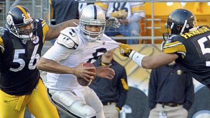 Steelers linebacker James Farrior gets a piece of Raiders quarterback Jason Campbell's jersey as he goes for a sack in the second quarter Sunday at Heinz Field.