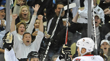 Penguins forwards Eric Tangradi, left, and Mike Rupp celebrate Kris Letang's second period goal in front of Senators forward Jarkko Ruutu during Monday's game at Consol Energy Center.