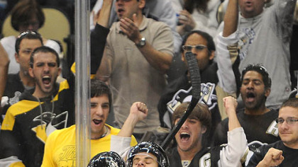 Penguins forward Tyler Kennedy celebrates with Mark Letestu scoring the first Penguins goal in the new Consol Energy Center in the third period.