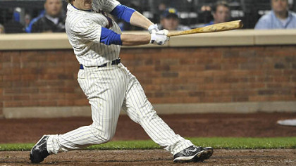 The Mets' Nick Evans hits a single off Pirates pitcher Chan Ho Park to score Ruben Tejada and win the game, 1-0, in the 10th inning.