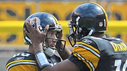 Quarterback Dennis Dixon talks with Hines Ward against the Falcons Sunday at Heinz Field.