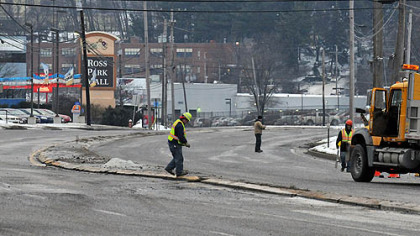 Normally a busy highway during the morning rush, some of the only activity Friday on McKnight Road were PennDOT workers putting down salt. Several water main breaks closed the roadway in Ross.