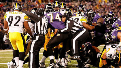 Referees break up a scuffle between the Steelers and Baltimore Ravens during the Sunday night's game in Baltimore. The scrum ensued after a Ravens lineman fired out early on James Harrison; Steelers players feel the act was a deliberate attempt to provoke Harrison.