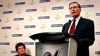 Bud Selig, commissioner of Major League Baseball, announces a program for scholarships for the underprivileged to attend the University of Wisconsin-Madison last night at Miller Park. At left is the university's chancellor, Biddy Martin.
