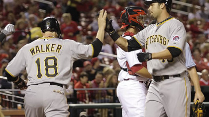 The Pirates' Garrett Jones is congratulated by Neil Walker next after his two-run home run in the first inning Tuesday at Busch Stadium.