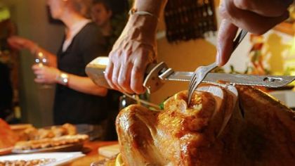 Carving the Thanksgiving turkey.