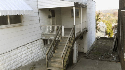 The apartment, which is behind the former video store.