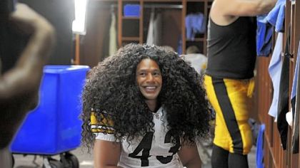 Troy Polamalu in the shampoo ad: The hair is a wig, but the smile is real.