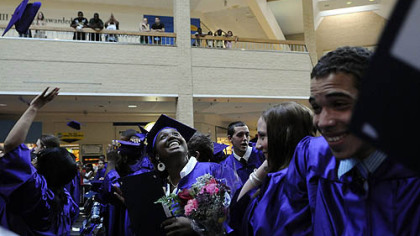 Octavia Shelly, center, 20, celebrates graduating from Clairton High School through the Phase 4 Learning Center at the Century III Mall in West Mifflin in May.
