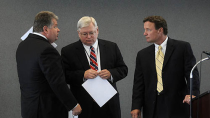 Consultant John Verbanac, left, talks with Jim Hassinger and Charlie Camp before a meeting of the Southwestern Pennsylvania Commission.