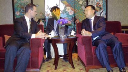 Mayor Luke Ravenstahl is greeted before a 10-course lunch by Tang Deng Jie, vice mayor of Shanghai, on Friday at the Grand Central Hotel in Shanghai. An interpreter is seated between and behind.