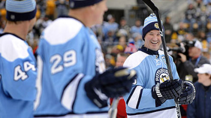 Penguins owner Mario Lemieux greets teammates Rob Brown and Phil Bourque