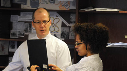 Teacher Chad Rucker listens to ninth-grader Brittany Stone during a cultural literacy class at City High Charter School in the Clark Building, Downtown