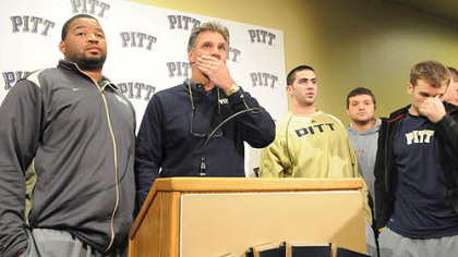 Surrounded and supported by his players, University of Pittsburgh football head coach Dave Wannstedt announces his resignation at the team's South Side facility. He will remain in the athletic department in a non-coaching capacity.