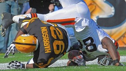 James Harrison upends the Browns' Benjamin Watson Sunday at Heinz Field.