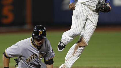 Mets shortstop Jose Reyes looks to first after forcing out the Pirates' Garrett Jones after Pedro Alvarez hit into a fourth-inning double play.