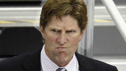 Red Wings coach Mike Babcock watches the first period.