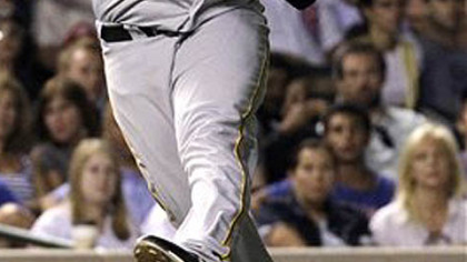 Pirates' baseman Pedro Alvarez throws out Chicago Cubs' Starlin Castro at first, during the second inning of last night's game at Wrigley Field in Chicago.