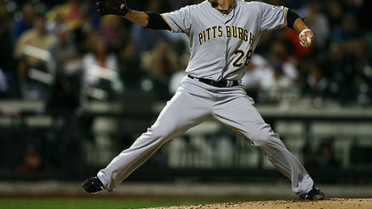 The Pirates' Paul Maholm pitches against the New York Mets.