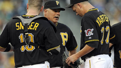 Pirates interim pitching coach Ray Searage talks to pitcher Jeff Karstens.