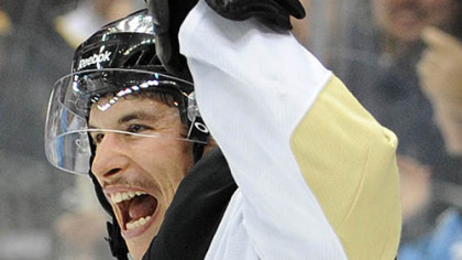 Sidney crosby celebrates a goal by Evgeni Malkin.