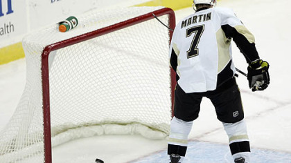 Penguins defenseman Paul Martin scores an empty-net goal during the the third period of Monday's game at the Prudential Center in Newark, N.J.