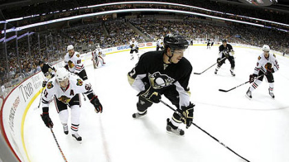 Penguins defenseman Simon Despres handles the puck in the corner.