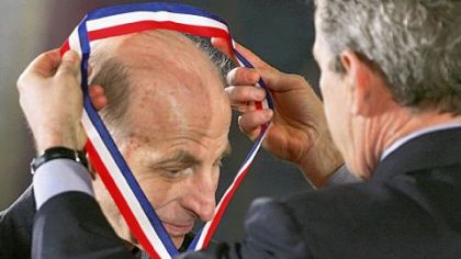 Watts S. Humphrey receives the National Medal of Technology from President George W. Bush on March 14, 2005, in the East Room of the White House in Washington.