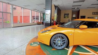 A Lotus Evora remains in the almost empty showroom at Ascot Imported Cars in Sewickley.