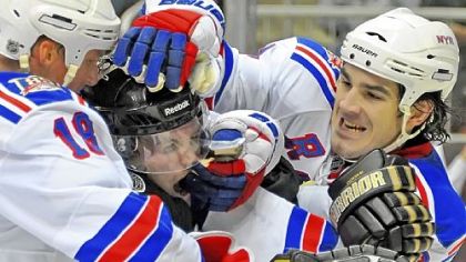 Matt Cooke mixes it up with Brian Boyle, right, and Marc Staal in the third period.