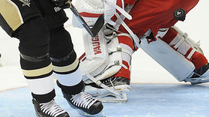 Penguins captain Sidney Crosby scores past Red Wings goaltender Chris Osgood during Wednesday's game at Consol Energy Center.