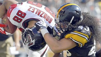 Steelers Troy Polamalu takes down Atlanta's Tony Gonzalez in the season opener.