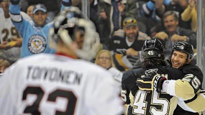 Penguins forward Max Talbot, right, celebrates a goal with forward Arron Asham against the Blackhawks goaltender Hannu Toivonen.