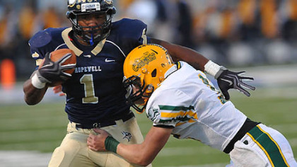 Hopewell's Rushel Shellis tackled by Blackhawk's Josh Desmond during Friday's game.