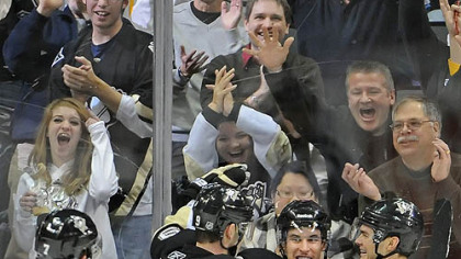 Penguins captain Sidney Crosby celebrates a second period goal in with teammates Paul Martin, Pascal Dupuis and Chris Kunitz during Wednesday's game against the Mapl Leafs at Consol Energy Center.