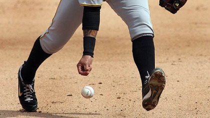 Pirates shortstop Ronny Cedeno loses control of a ball hit by Marlins' Gaby Sanchez during the sixth inning.