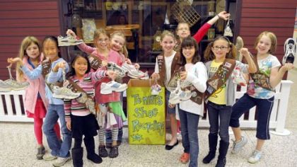Members of Girl Scout Troop 50139 collect used athletic shoes for recycling as part of a troop project at O'Hara Elementary School. Troop members, from left, are Diana Crookston, Ziya Xu, Nicole Garcia-Tunon, Clara McCormick, Laura Copeland, Maura Curry, Jane Jacobs, Cara Himmel, Tessa Burns and Aubrey Rice.