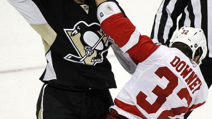 Penguins forward Jesse Boulerice fights Red Wings forard Aaron Downey in the first period.