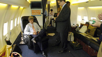 Democratic presidential candidate John Kerry, left, is briefed by David Morehouse aboard his campaign plane in 2004.