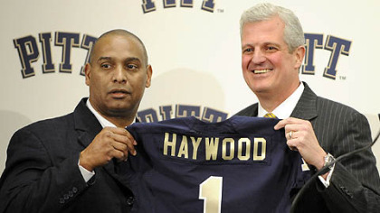 New Pitt head coach Michael Haywood poses with athletic director Steve Pederson during a press conference Thursday.