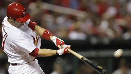 The Cardinals' Matt Pagnozzi hits a solo home run in the second inning.