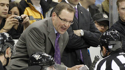 Penguins coach Dan Bylsma talks with referee Tim Peel in the third period.