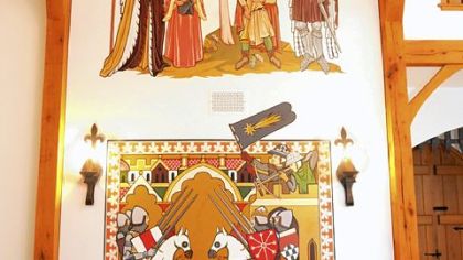 Hand painted murals on the walls of the great hall in Cara and Char Branstetter's castle home in Marshall.