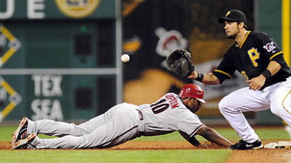 Diamondbacks pinch runner Justin Upton, running for Adam LaRoche, gets back to first safely against Pirates first baseman Garrett Jones during the ninth inning.