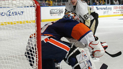 Penguins captain Sidney Crosby is stopped by Islanders goaltender Rick DiPietro on a shootout attept during Wednesday's game at Nassau Coliseum in Uniondale, New York.
