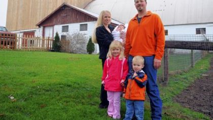 Marla and Paul Critchlow Jr. with their children Ann Rose, 3 months; Ila, 4, and Preston, 2, on their farm in Harrisville, Butler County.