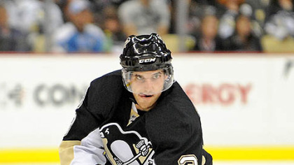 Penguins defenseman Alex Goligoski skates up ice.