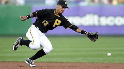Pirates Ronny Cedeno can't come up with a ball hit by Mets Jose Reyes in the first inning.