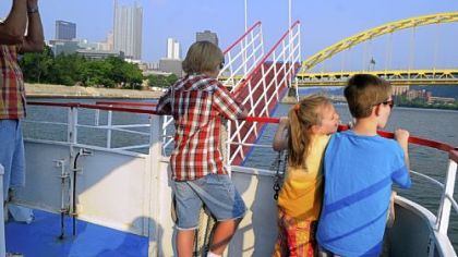 Young river enthusiasts look out over the Ohio River toward the Point during a Gateway Clipper Fleet outing July 13.